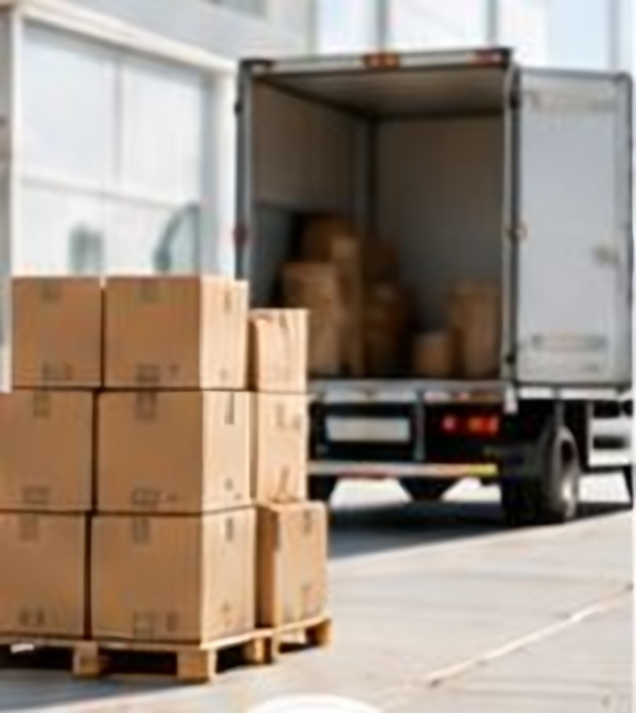 Delivery truck being loaded with dispatched cartons